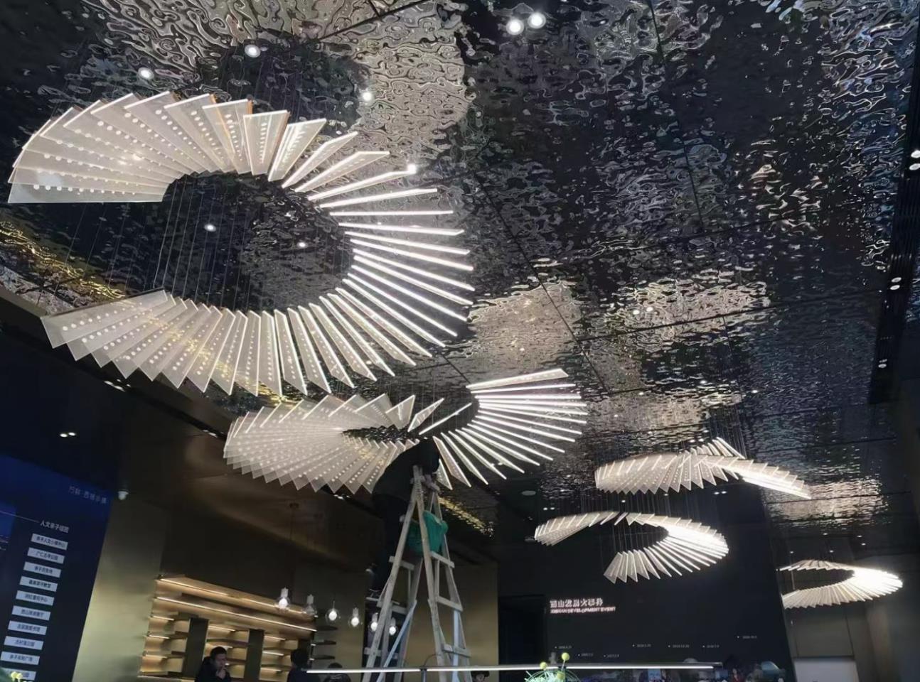 Block shaped white semicircular chandelier in sales center